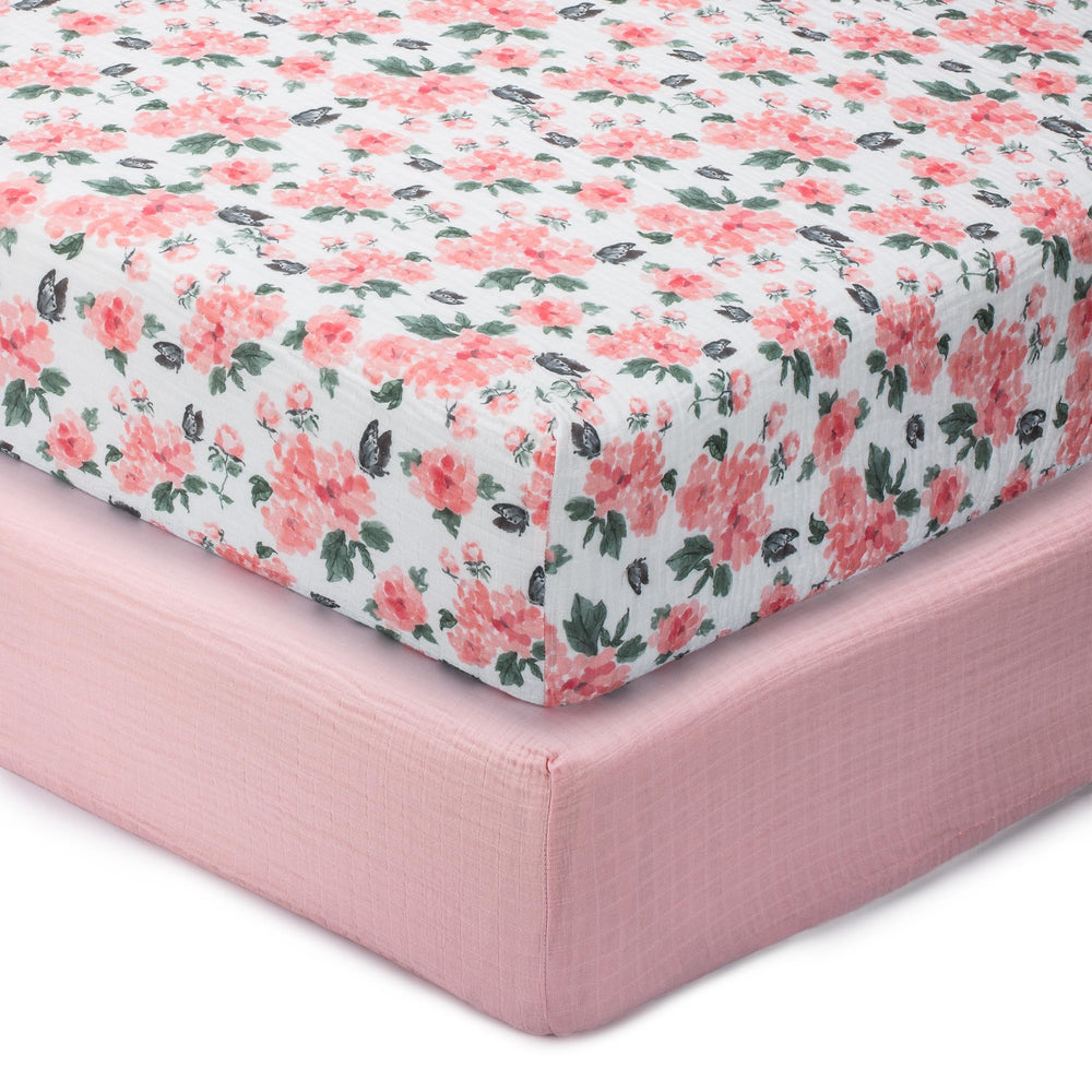 LollyBanks Muslin crib sheet with pink peony design offers breathable comfort for naps