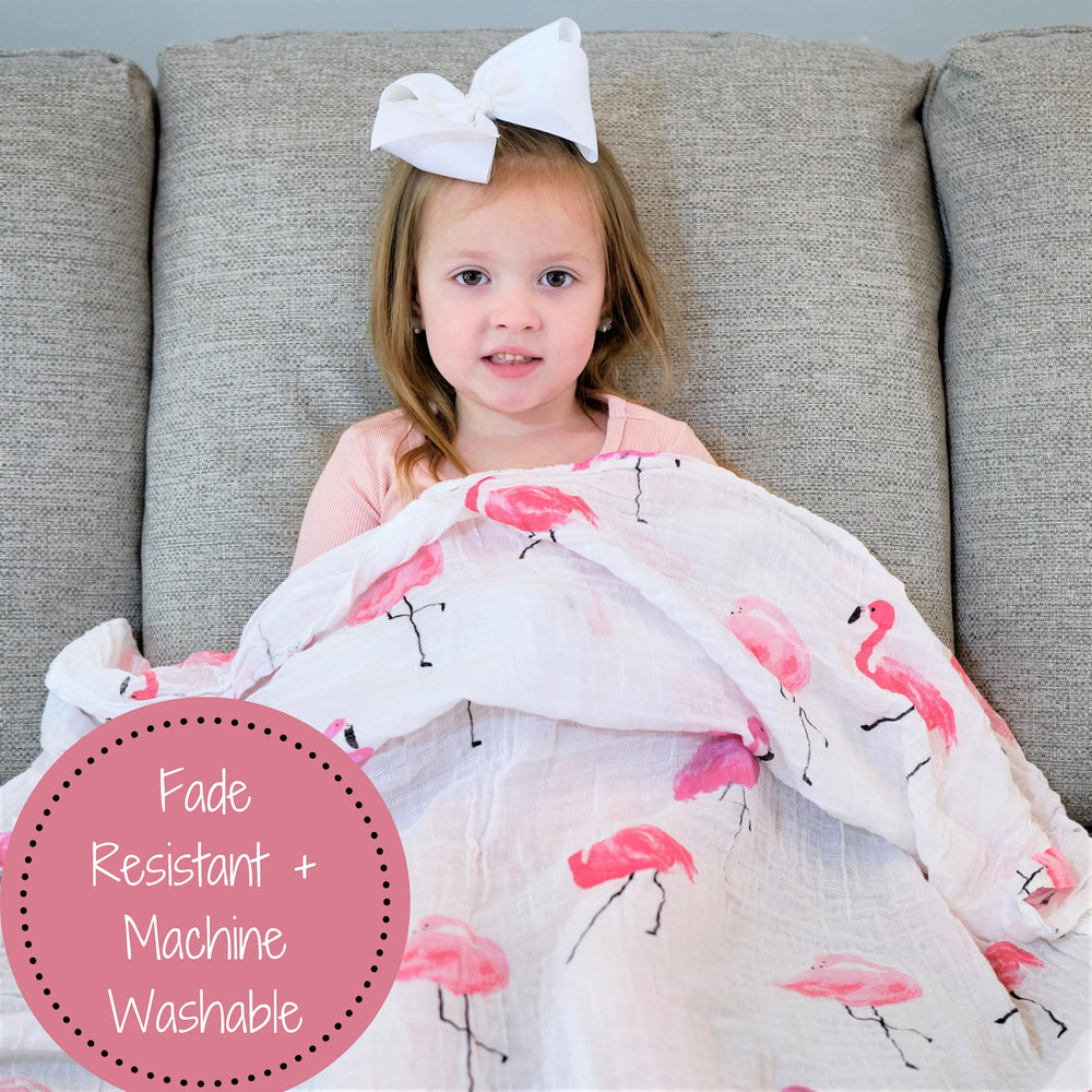 LollyBanks flamingo-print swaddle in stroller demonstrates portable baby comfort.