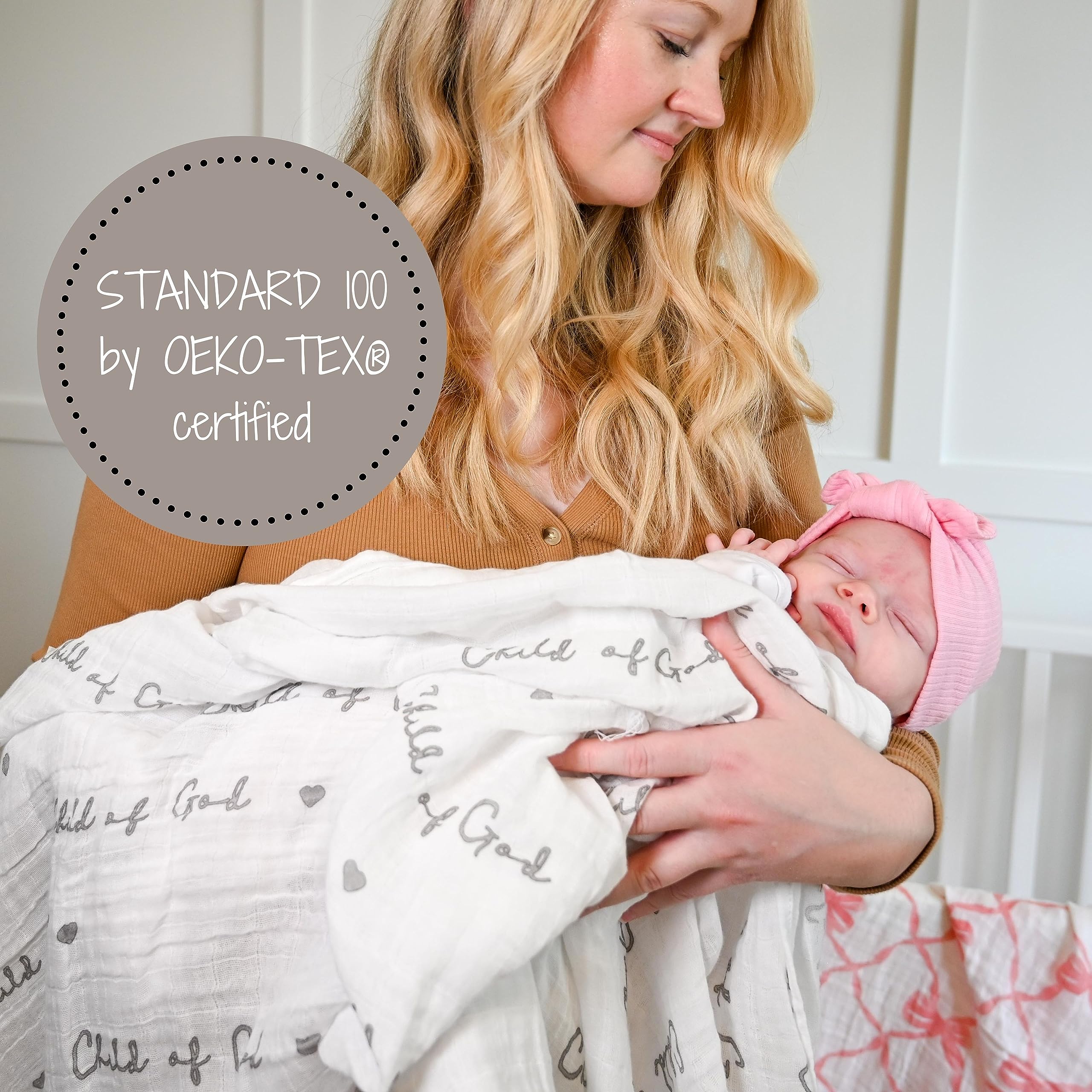 LollyBanks Muslin Swaddle Blankets 2pack displayed on crib, adds nursery decor charm.