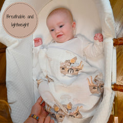 LollyBanks Muslin Swaddle Blankets 2pack script print close-up shows soft cotton texture for gentle wrapping.