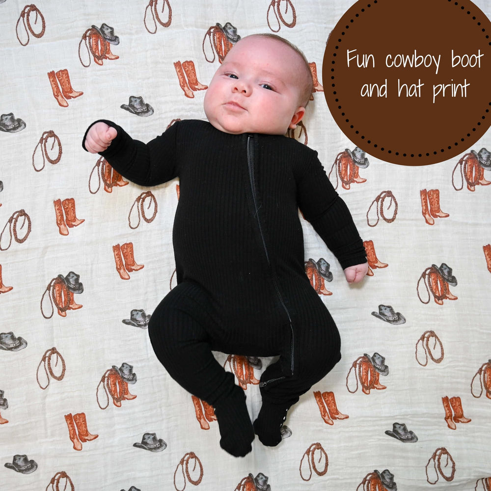 LollyBanks muslin swaddle wrapped around a baby for secure newborn comfort