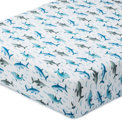 LollyBanks sharks print crib sheet with bold design and breathable comfort for naps.