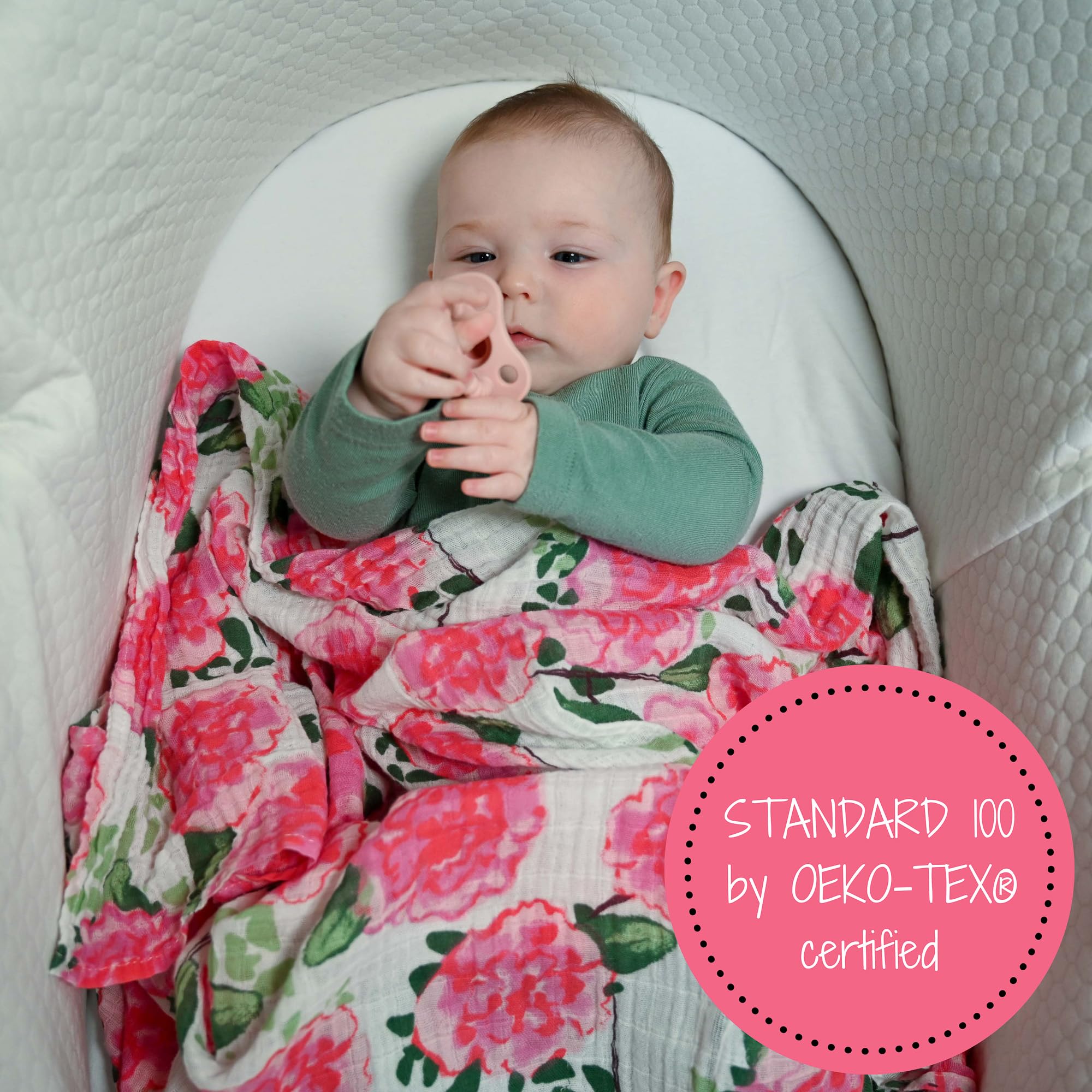 LollyBanks swaddle in use demonstrates versatility as burp cloth and nursing cover.