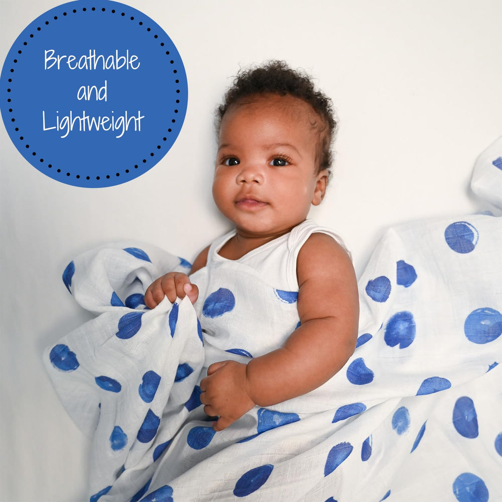 LollyBanks Swaddle Blanket blue dots wrapped around baby for cozy snuggle