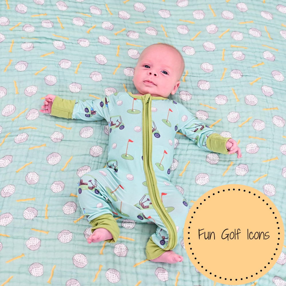 LollyBanks swaddle blanket on crib decor featuring golf print design