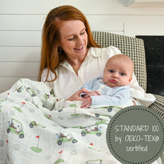 LollyBanks golf-print swaddle on crib as nursery decor