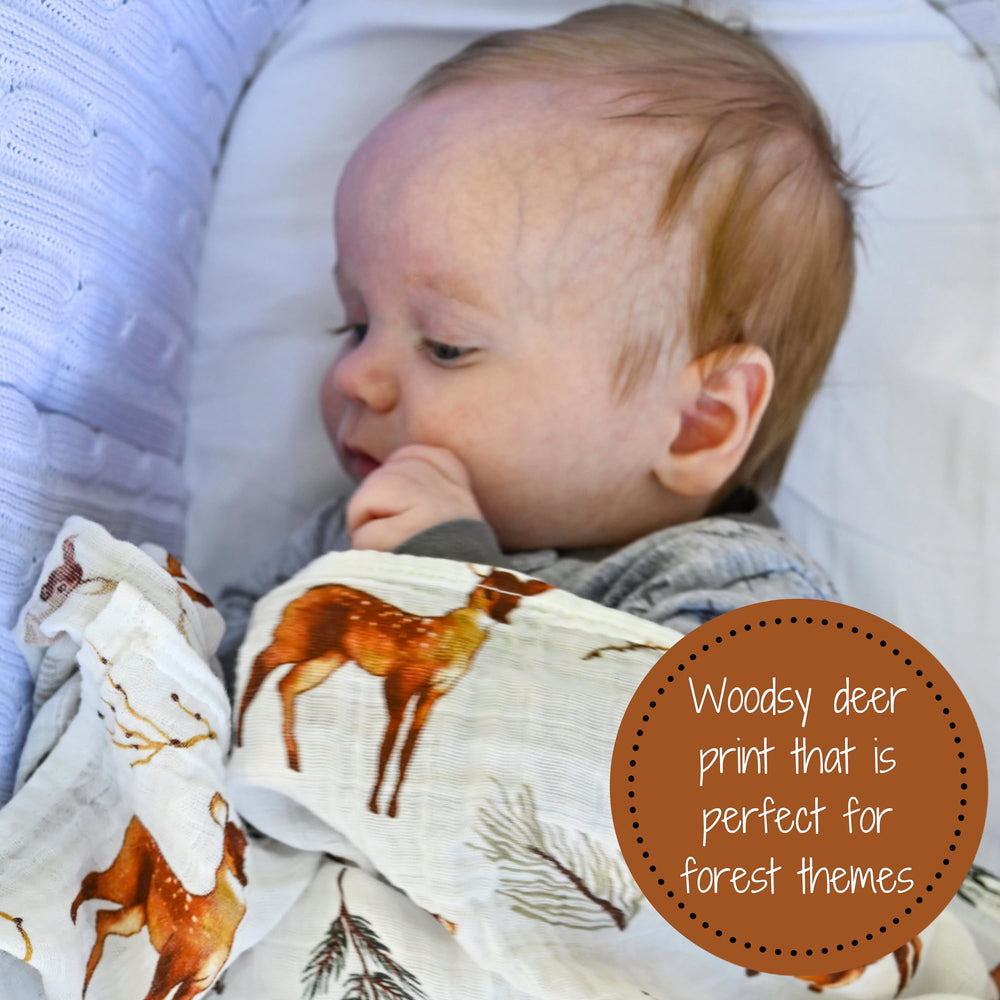 LollyBanks swaddle blanket in soft cotton muslin for newborn comfort.