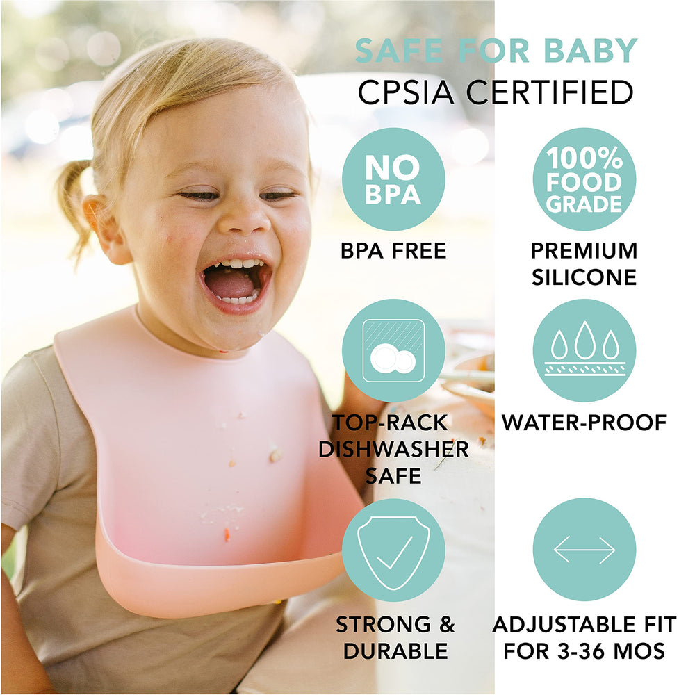 Loulou Lollipop bib Coconut Cream on table highlights catch-all pocket.