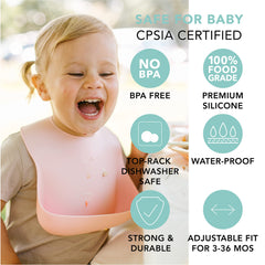 Loulou Lollipop bib Coconut Cream on table highlights catch-all pocket.