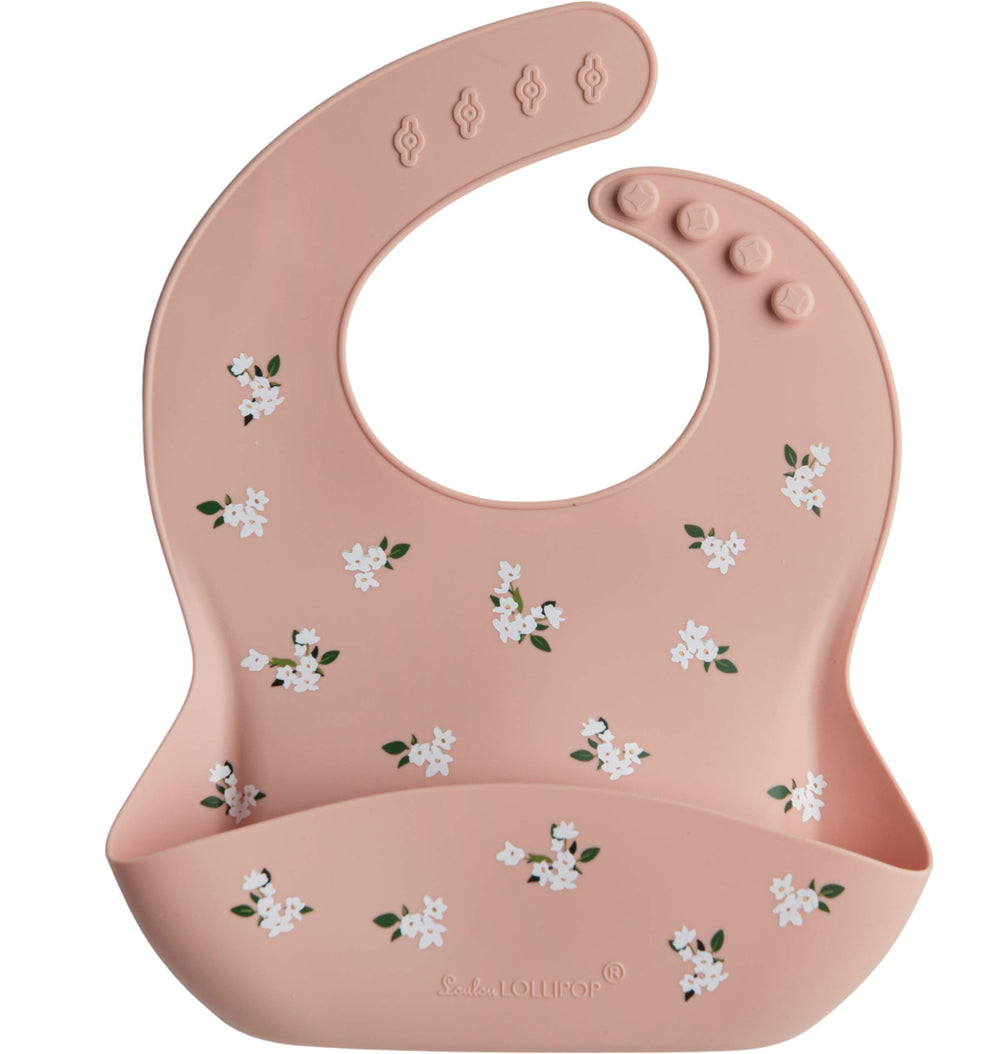 Loulou Lollipop soft silicone bib close-up highlights waterproof, stain-resistant fabric for quick wipe-down.