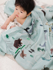 Loulou Lollipop world-map swaddle baby-wrapped offering breathable comfort during calm daytime naps.