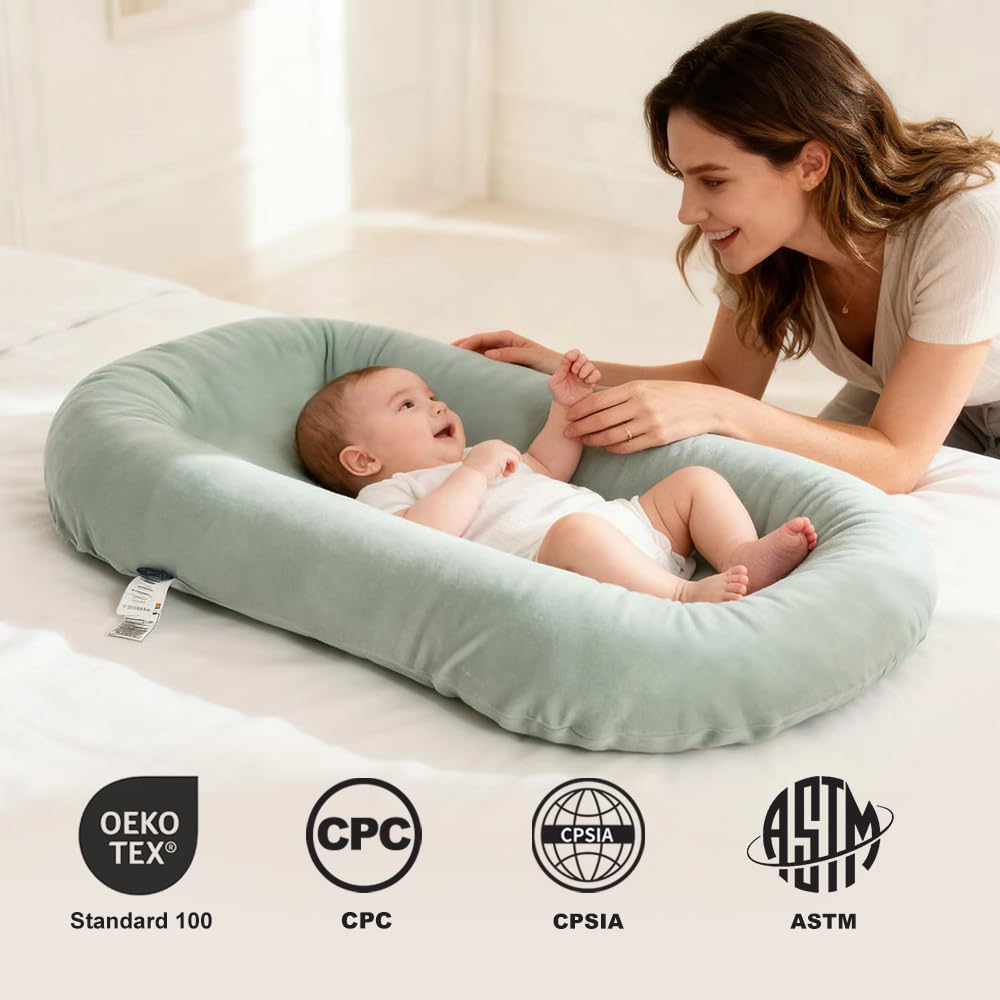 LOVE MAGE infant lounger with waterproof inner surface for easy spill cleanup.