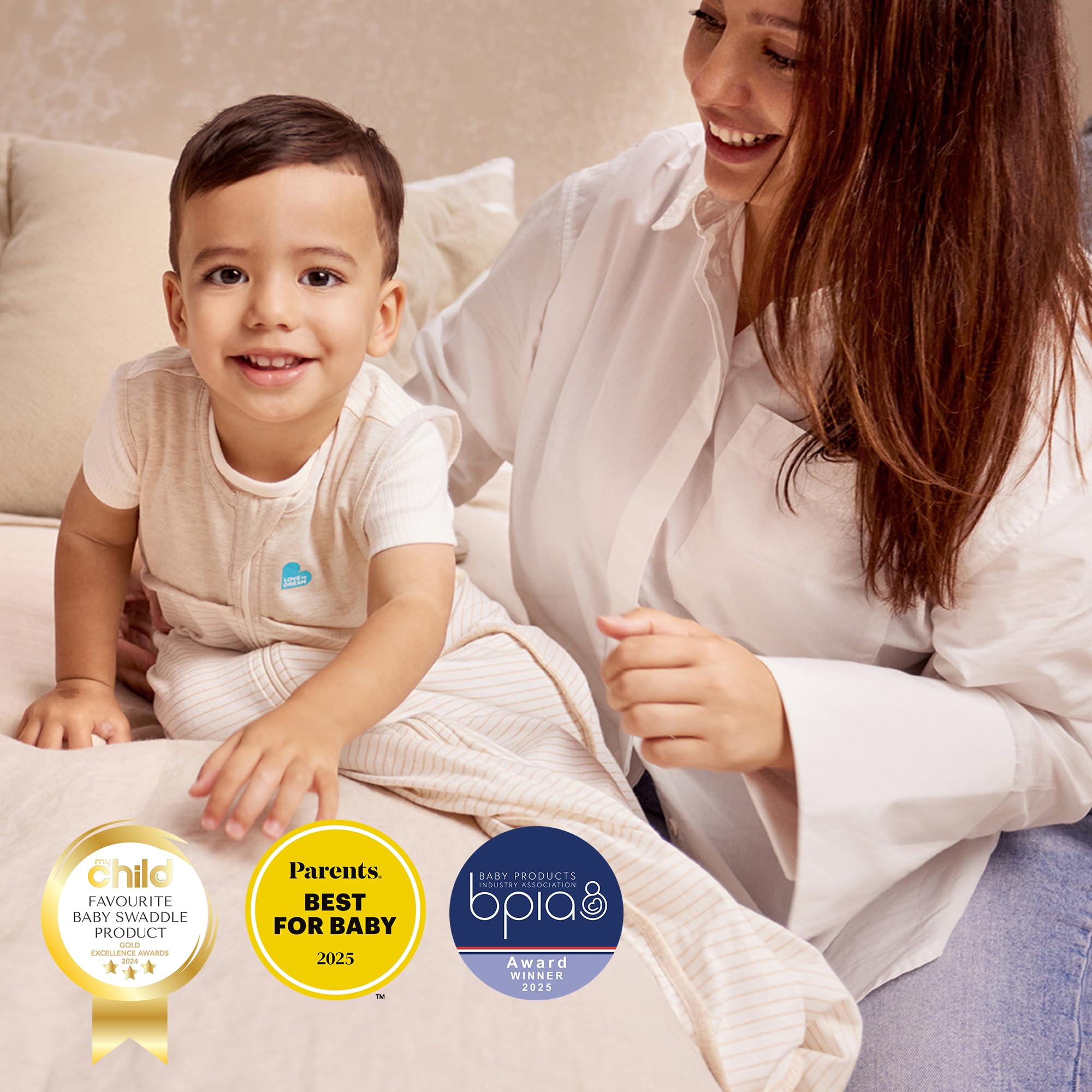 Love to Dream sleep suit on hanger showing machine washable convenience