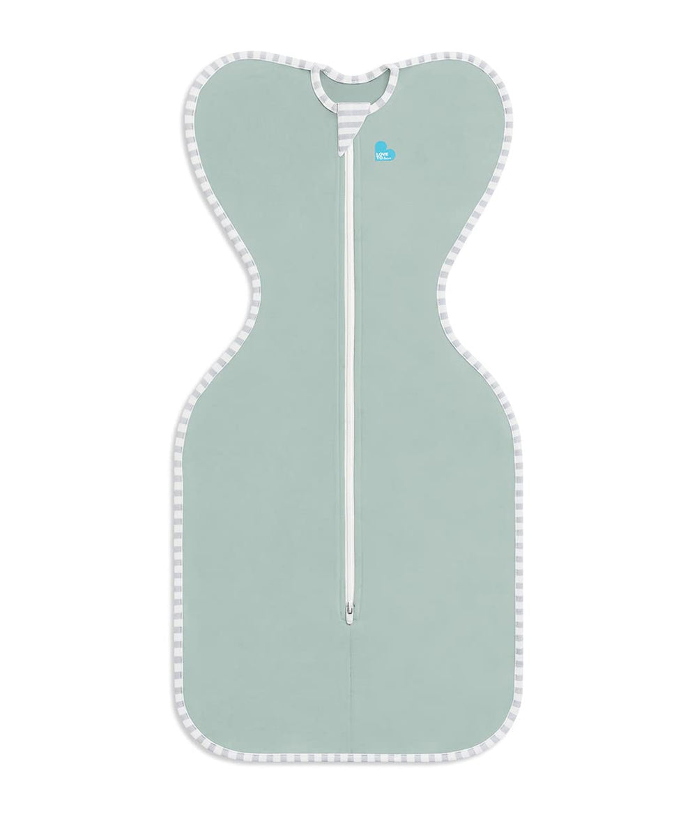 Love to Dream Swaddle Up Olive baby sleeping scene highlights calm rest.