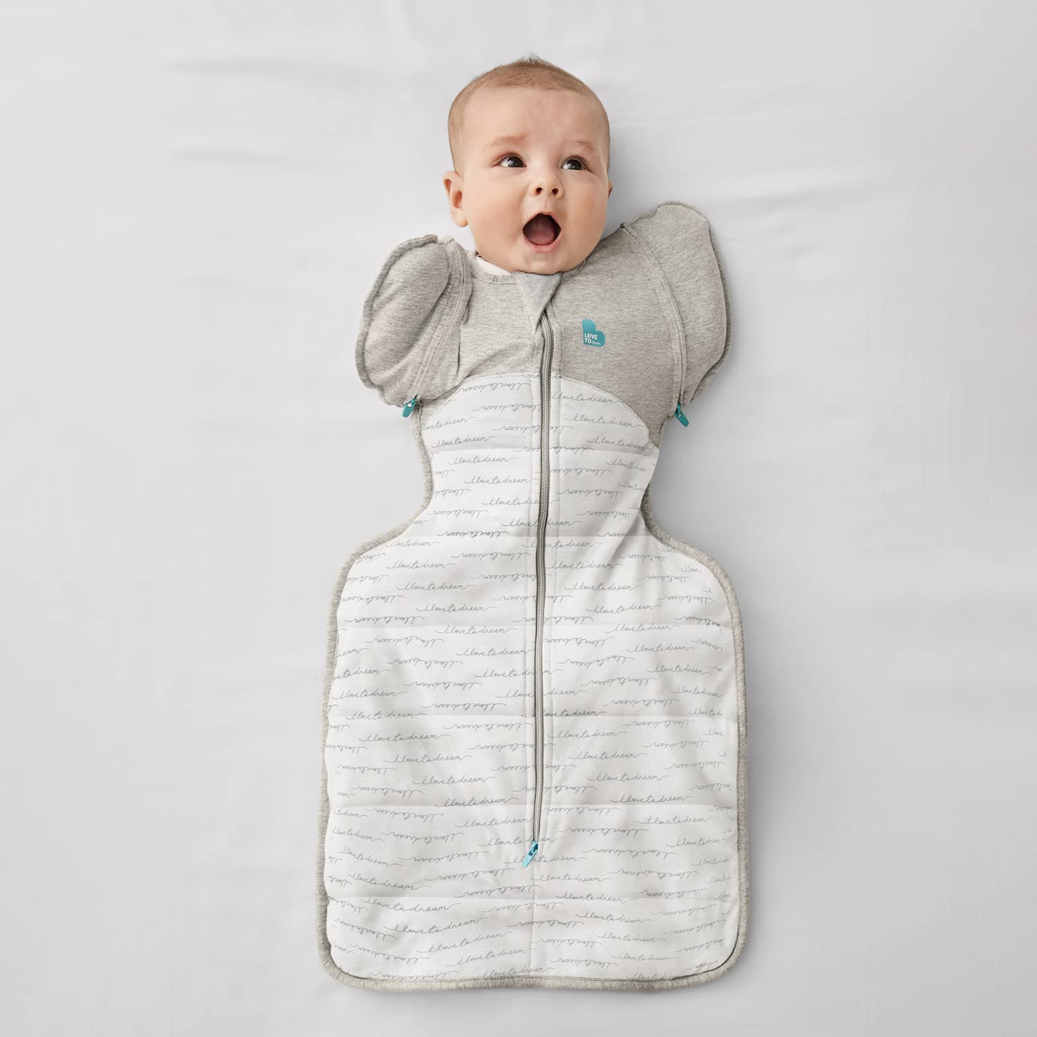 Love to Dream Swaddle Up Transition Bag zip-off wings closeup shows arms-free option.