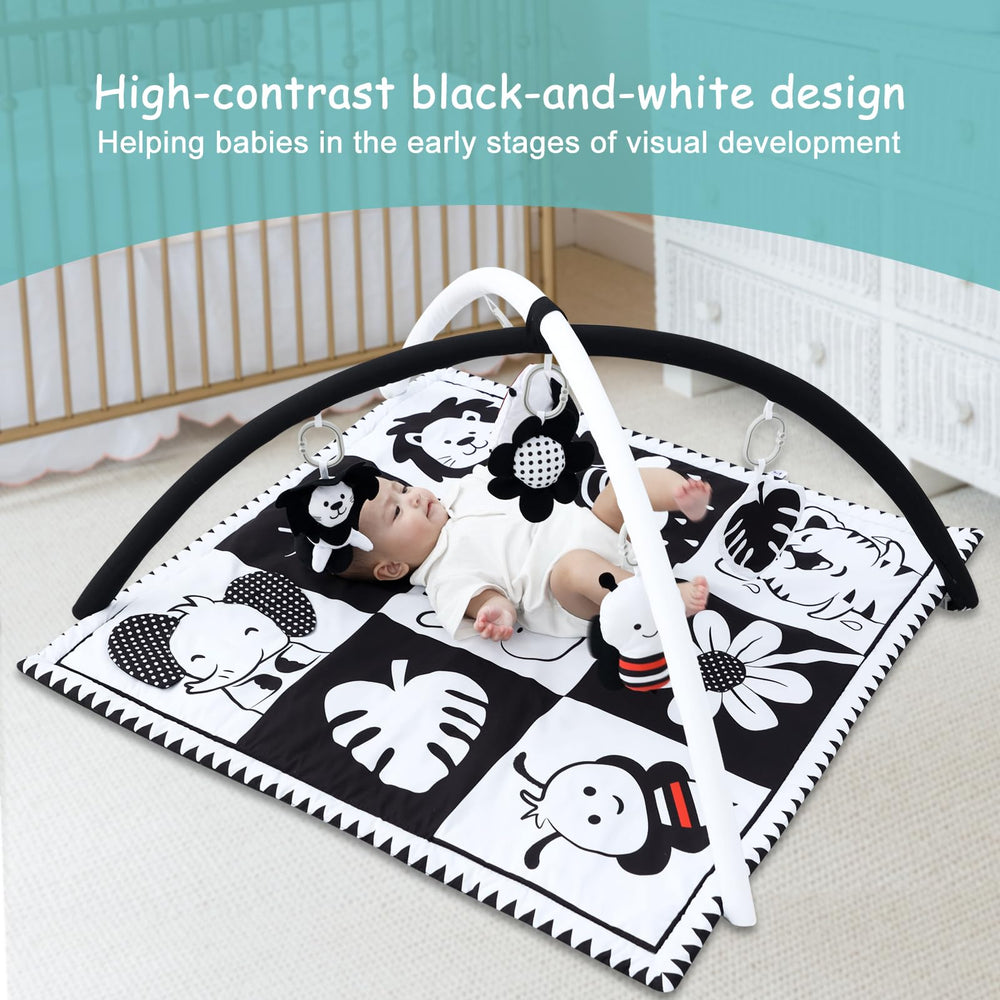 Lovvie & Joy activity gym with crinkle toy stimulates tactile exploration.