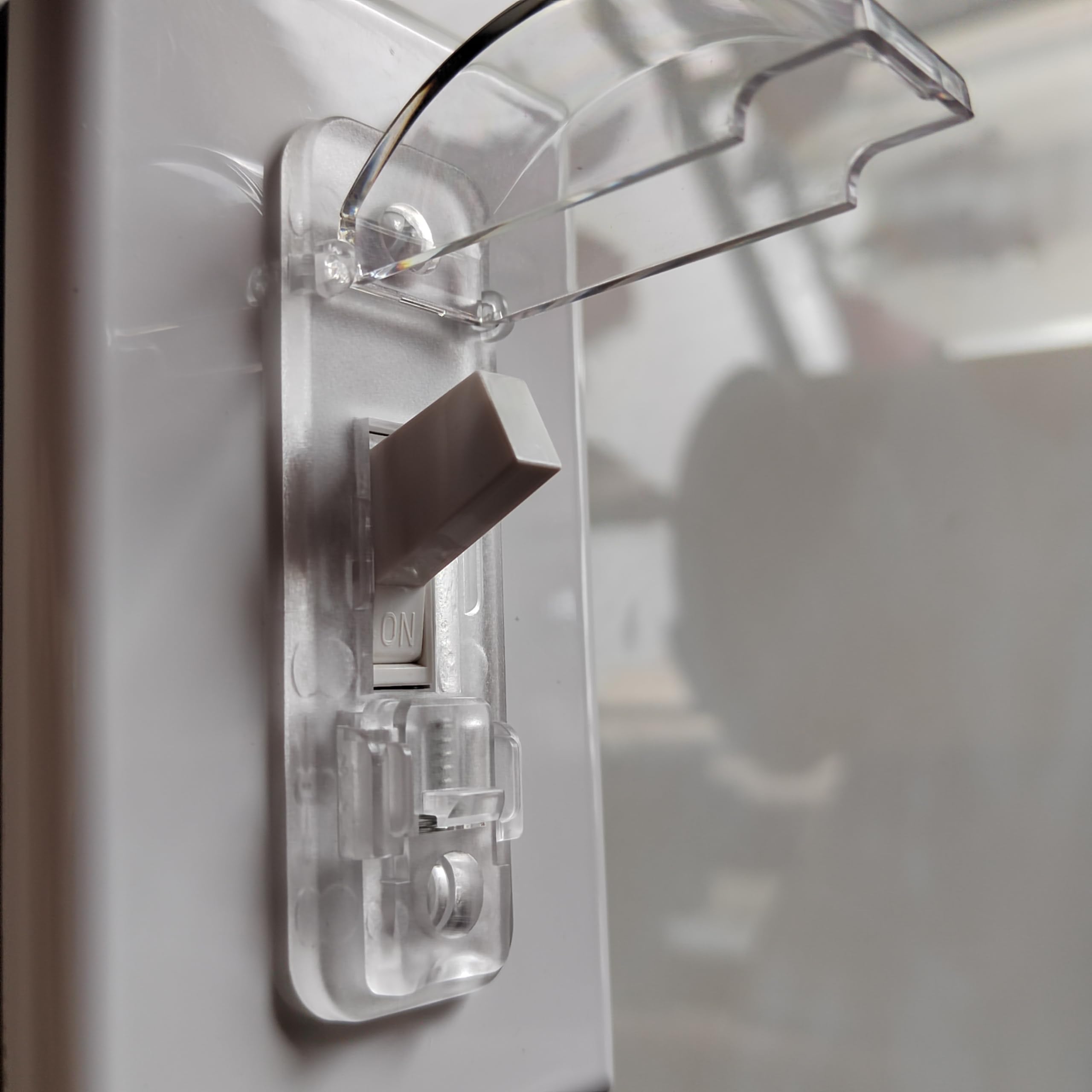 LRANFOW toggle switch guard installed on a standard switch.