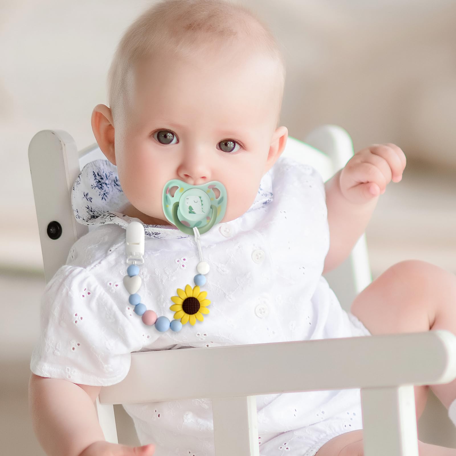 LSTRAGY pacifier clips two-pack shown in baby's hands for easy access