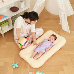Lucakuins baby lounger captured during playtime bonding with awake baby and family interaction.