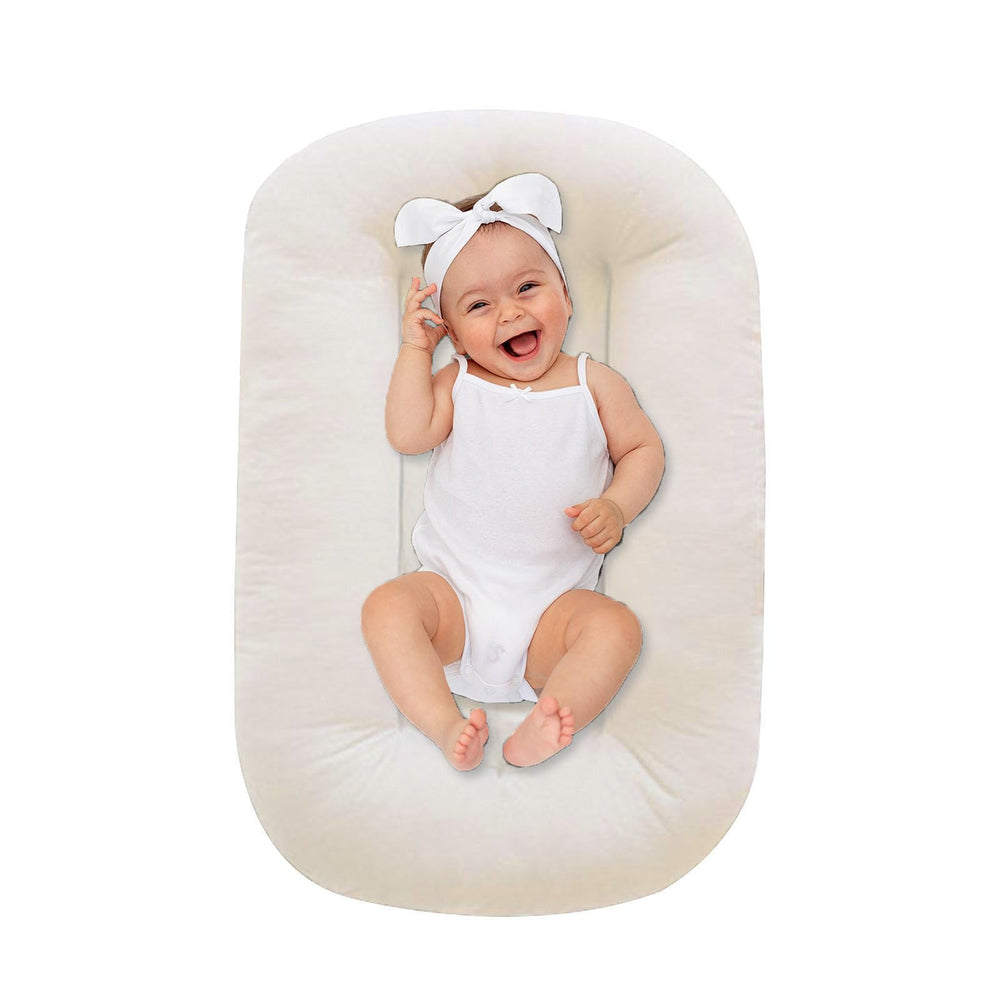 Lucakuins baby lounger white cotton close-up shows soft, breathable fabric for infant comfort.