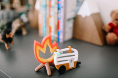 Lucy Darling Little Camper teether campfire textured flame area for safe mouthing during play.