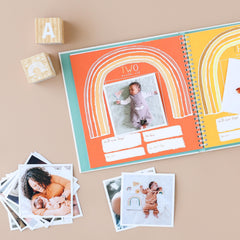 Lucy Darling Little Rainbow pages spread highlights colorful prompts and photo moments for milestones.