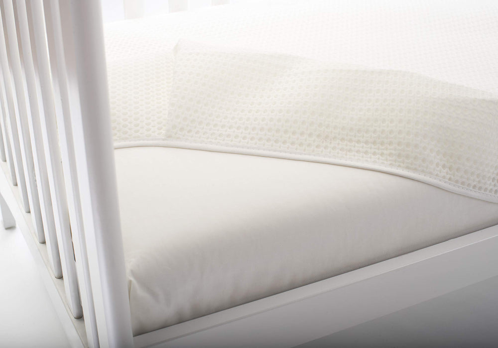 Lullaby Earth Breathe Safe Mattress Pad machine-washable surface simplifies care