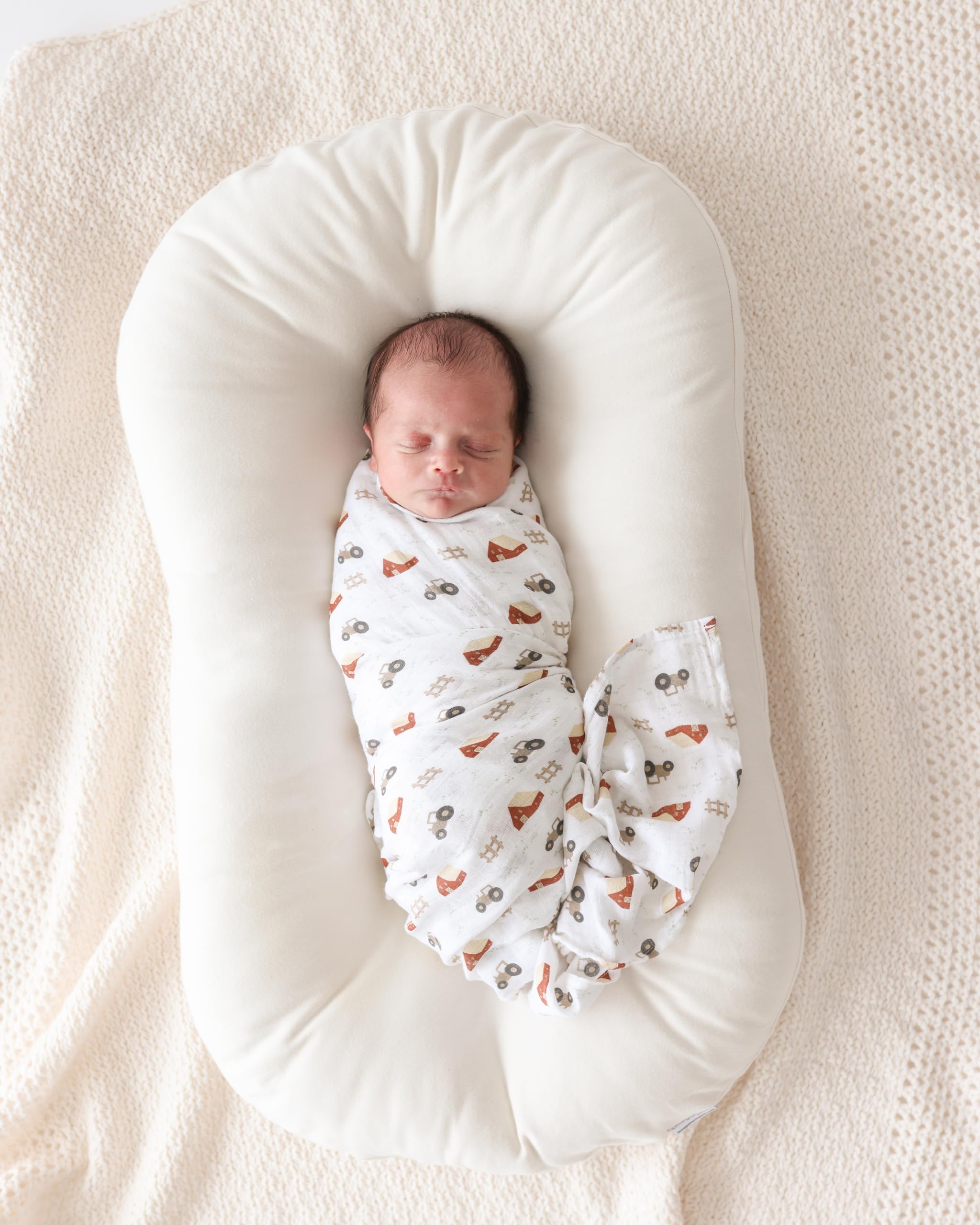 Lulujo Baby Swaddle Nursing Cover use shown with blanket draped.