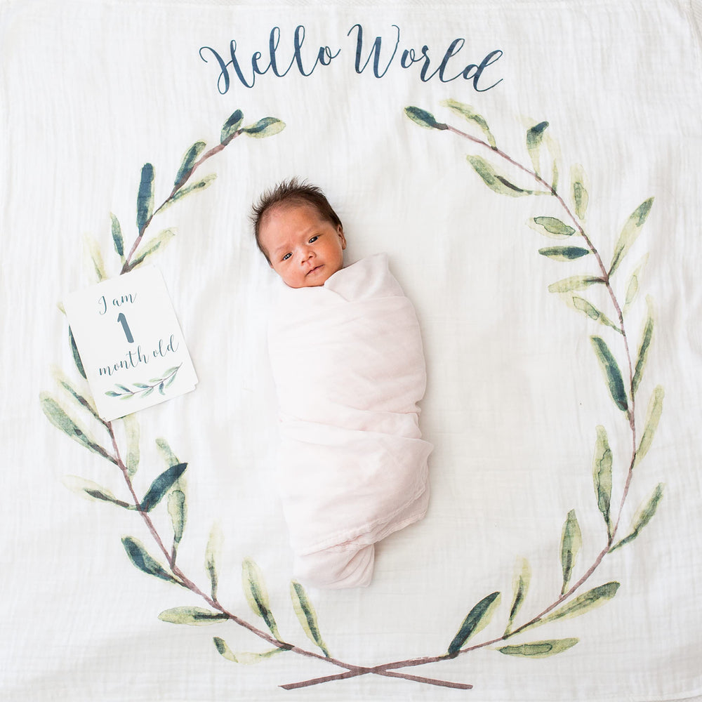 Lulujo blanket laid flat as a photogenic backdrop for milestone shots.