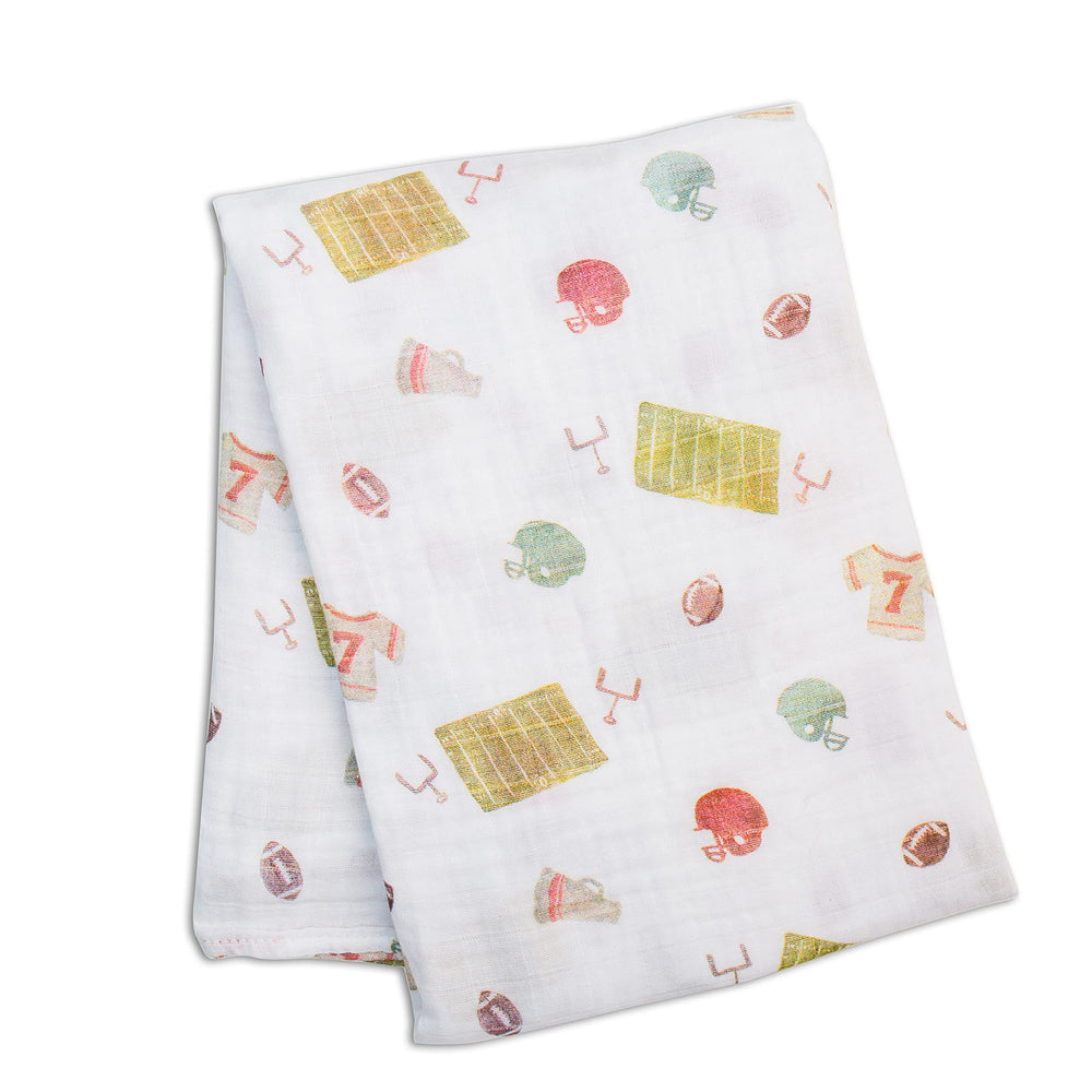 Closeup of Lulujo football swaddle pattern showing breathable cotton for gentle baby comfort.