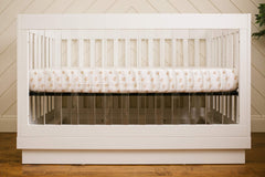 Lulujo Muslin Crib Sheet Rainbows nursery-ready design complements modern color palettes.