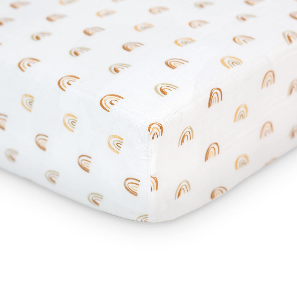 Lulujo Muslin Crib Sheet Rainbows close-up shows soft, breathable fabric for baby comfort.
