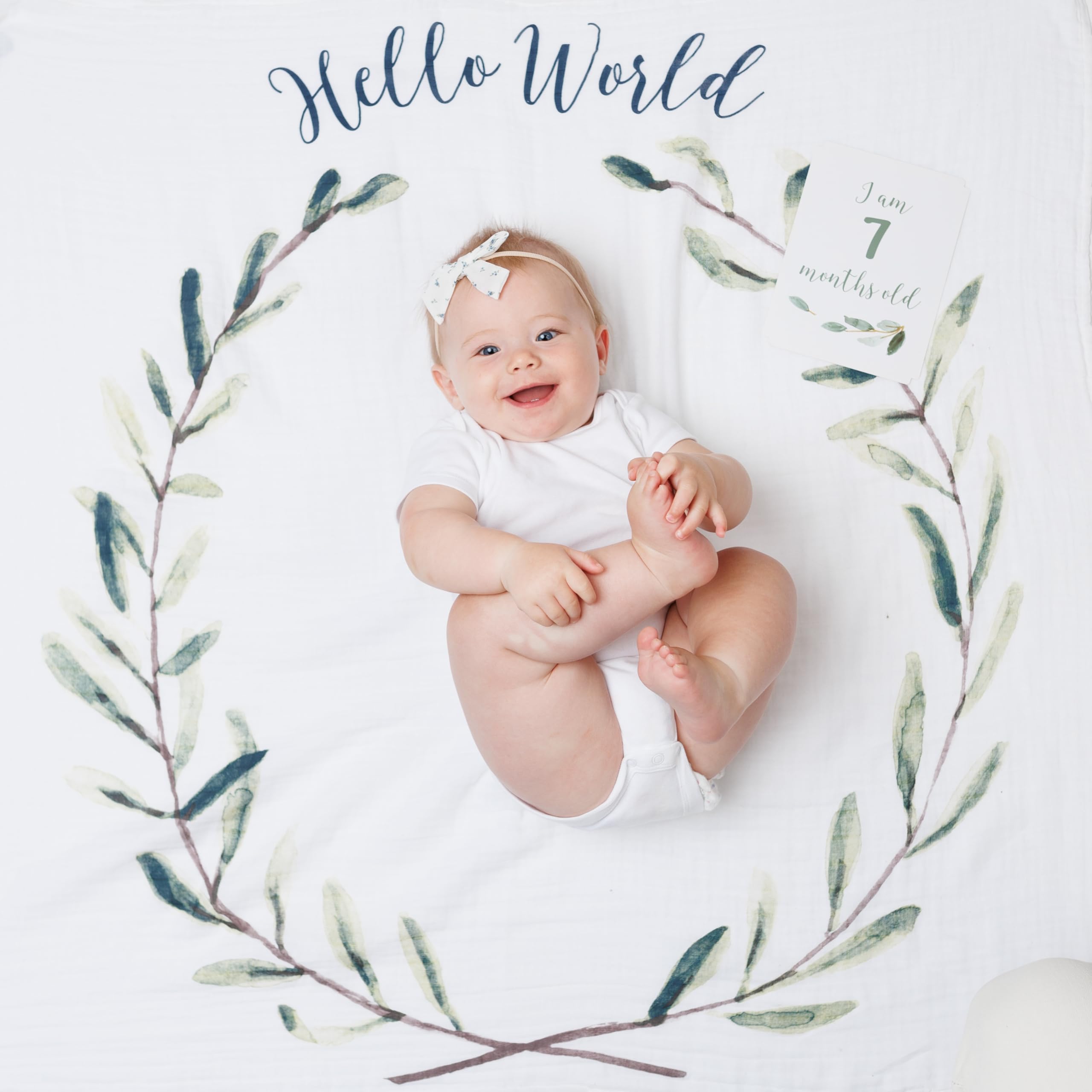 Lulujo spread blanket used as a soft photo backdrop on beds or floors.