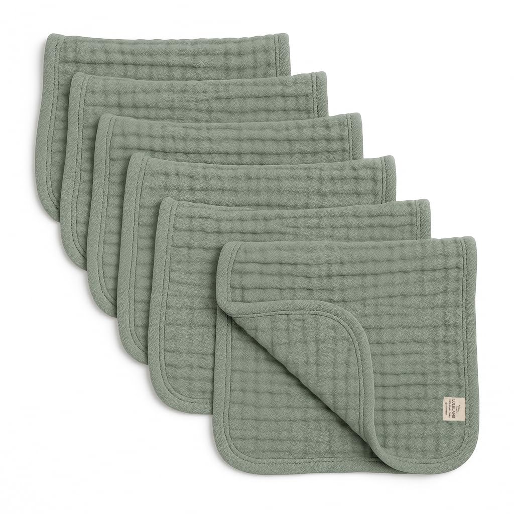 Lululamb six-layer muslin burp cloths folded, highlighting absorbency for drool and spills.