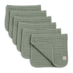 Lululamb six-layer muslin burp cloths folded, highlighting absorbency for drool and spills.