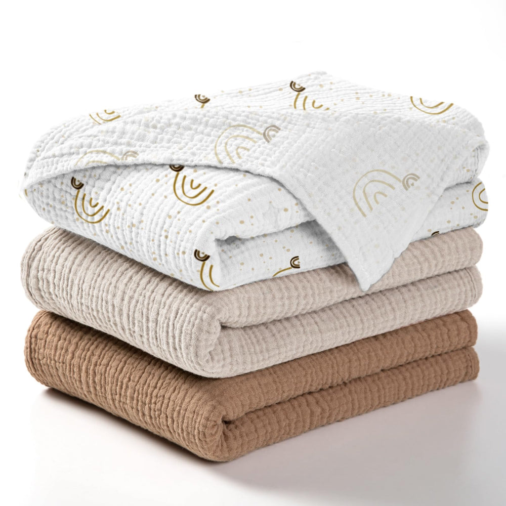 Lulumoon baby muslin swaddle blanket rainbow brown packaging shows gift-ready presentation.