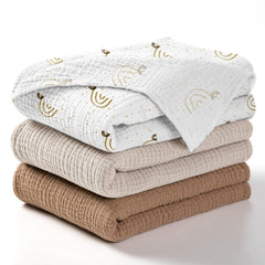 Lulumoon baby muslin swaddle blanket rainbow brown packaging shows gift-ready presentation.