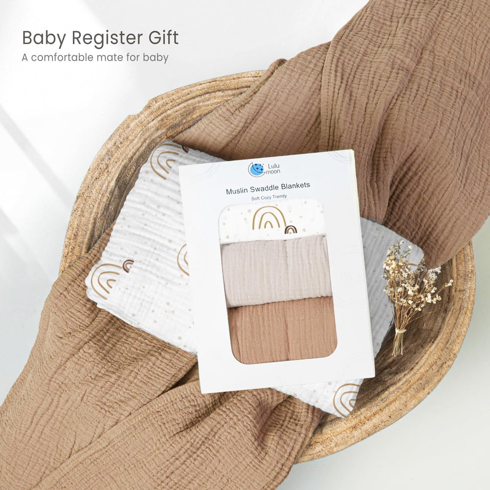 Lulumoon baby muslin swaddle blanket used as sun-shield stroller cover.