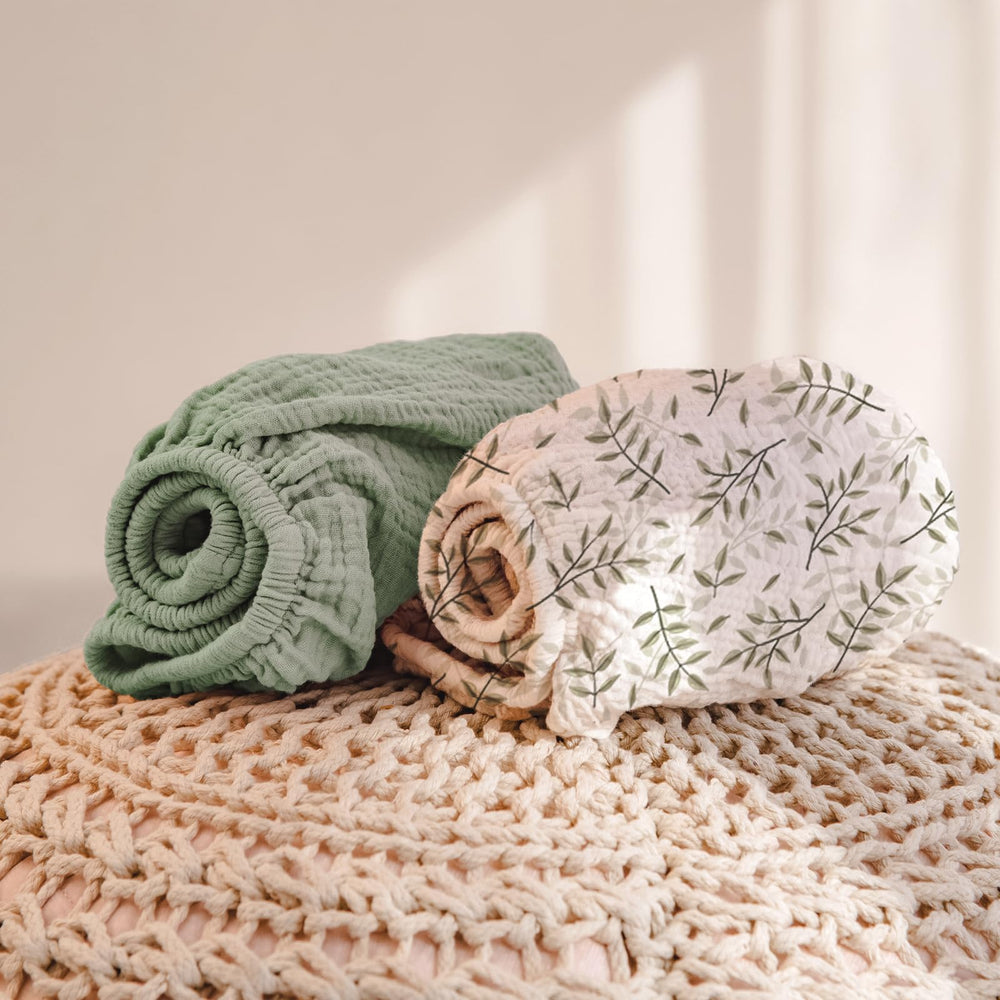 lulumoon botanical leaf print - calming nursery decor for a peaceful diaper change.
