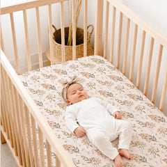Lulumoon fitted crib sheets: boho floral print close-up adds charming nursery decor for baby girls.