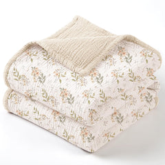 Lulumoon Muslin Baby Blanket Ivory Flower closeup emphasizes soft breathable cotton for newborn comfort