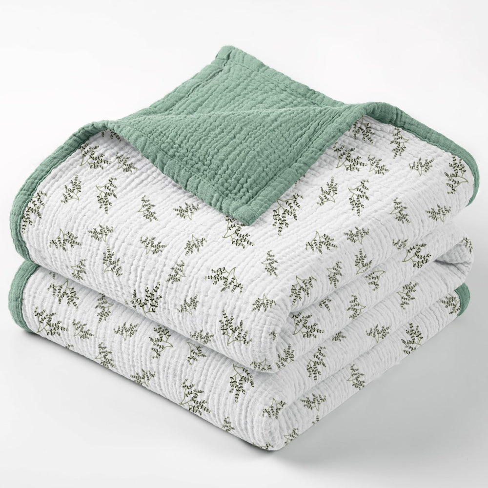 Lulumoon muslin blanket with Lotusleaf Tree print offers breathable baby comfort.