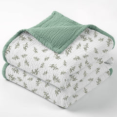Lulumoon muslin blanket with Lotusleaf Tree print offers breathable baby comfort.