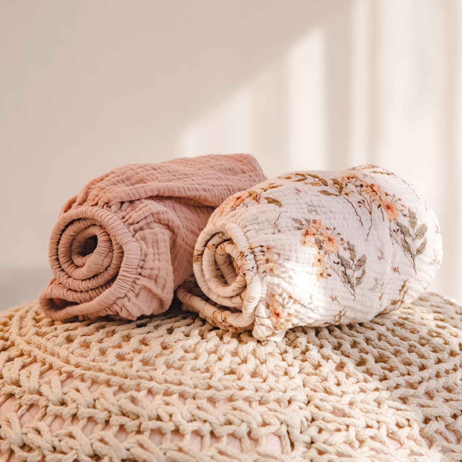 Lulumoon muslin changing pad cover with elastic edges for secure, slip-free fit.