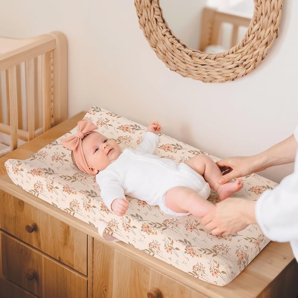 Lulumoon muslin changing pad cover with floral boho pattern adds calming nursery style.