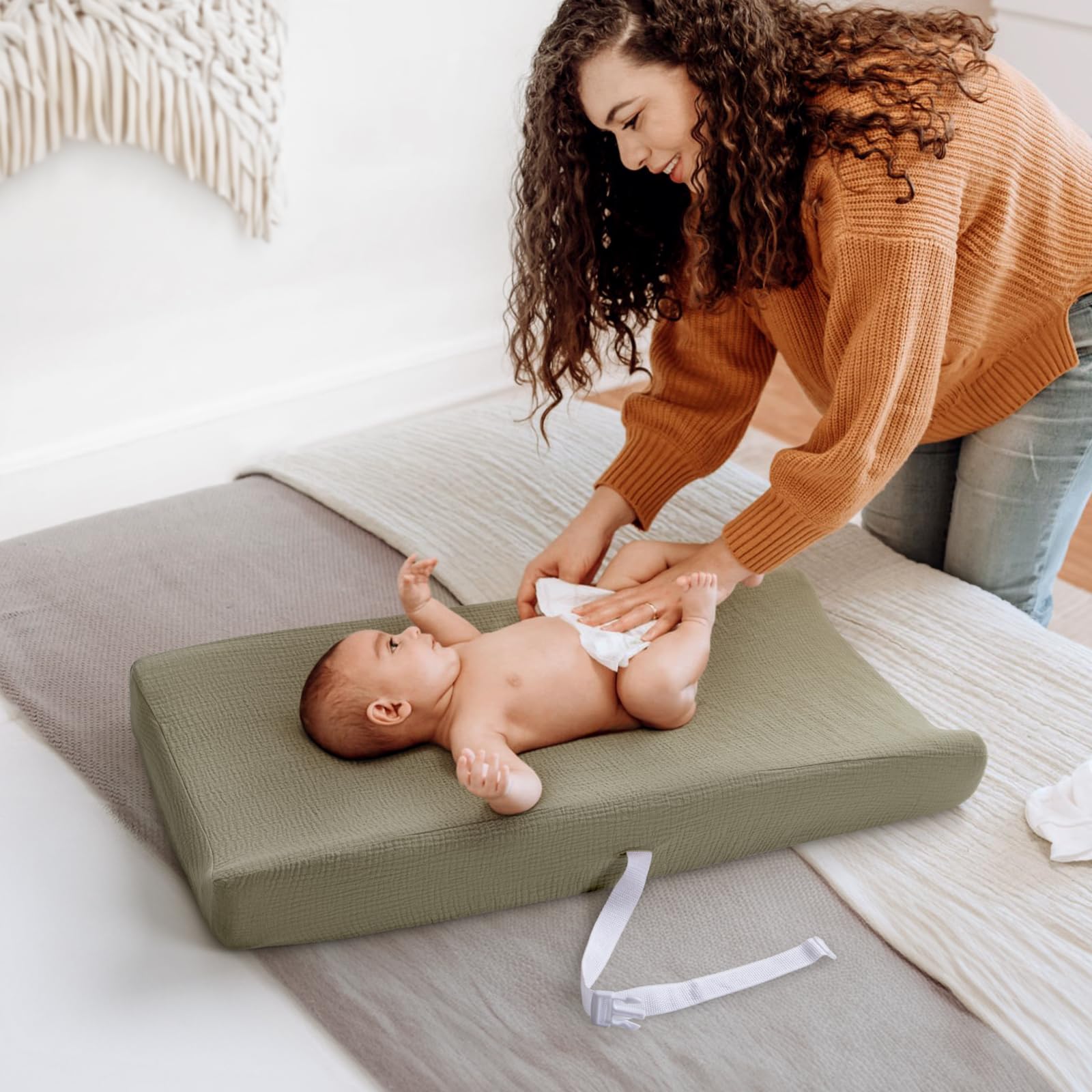 Lulumoon muslin changing pad cover on pad demonstrates breathable comfort during changes