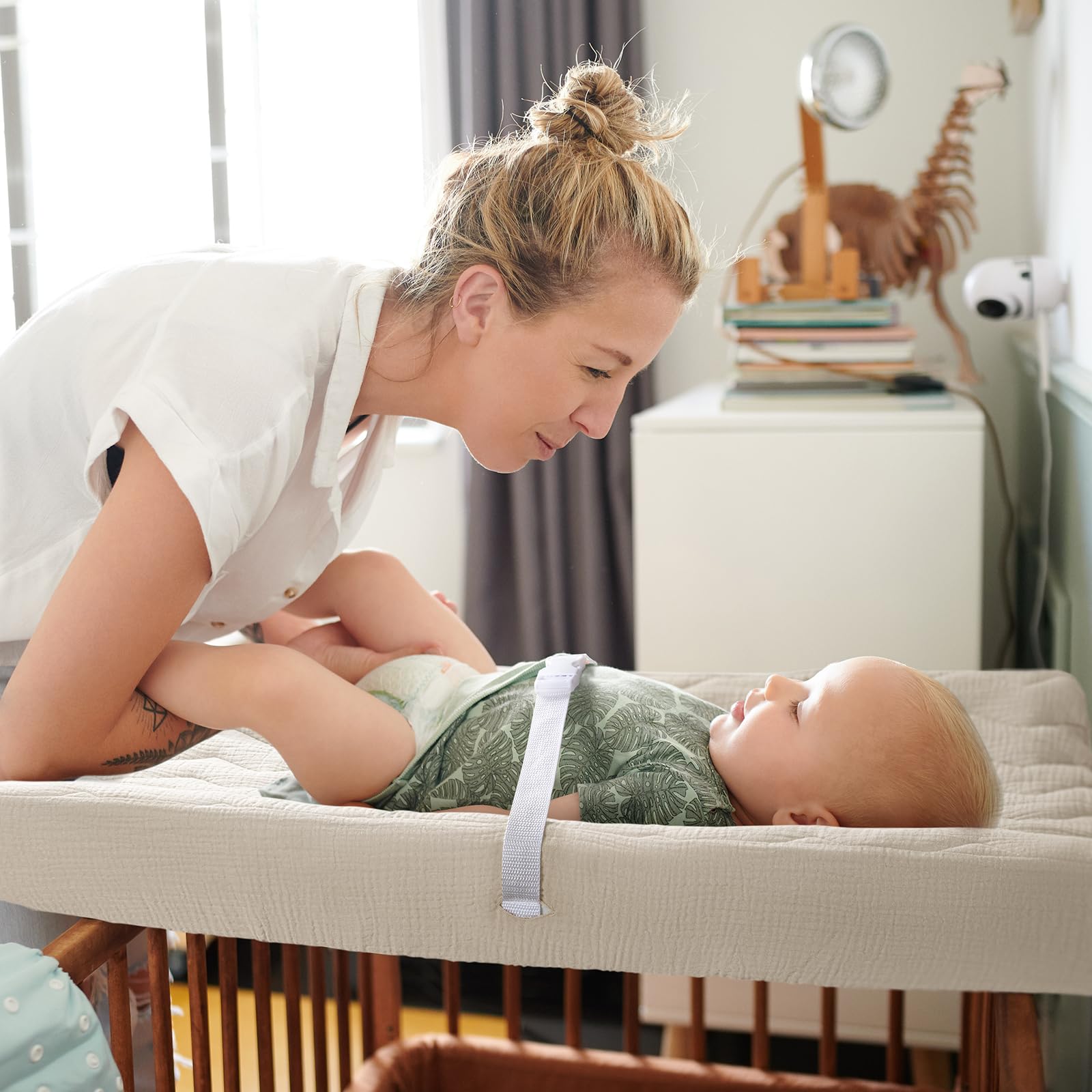 lulumoon muslin-changing-pad-cover safety-holes highlight belt access during changes