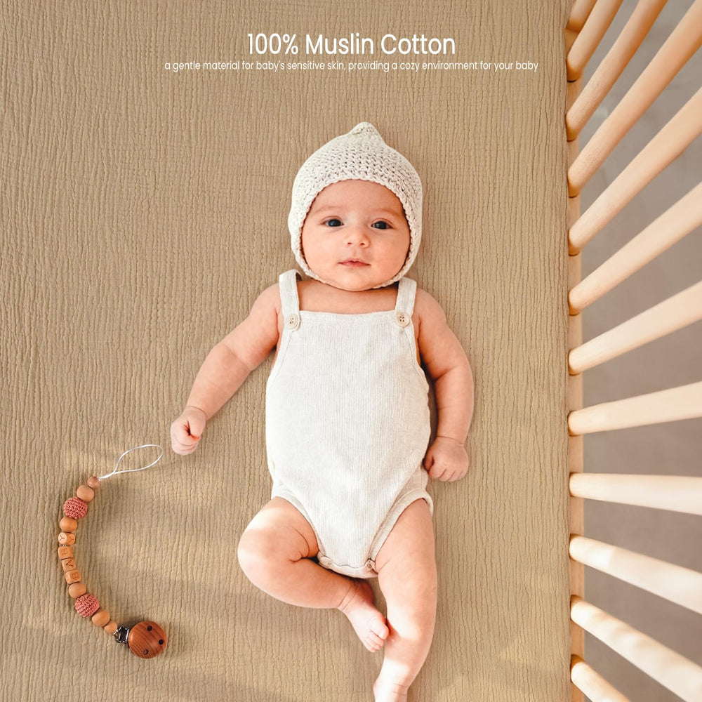 Lulu Moon muslin crib sheets in a nursery setup for cohesive design and practicality