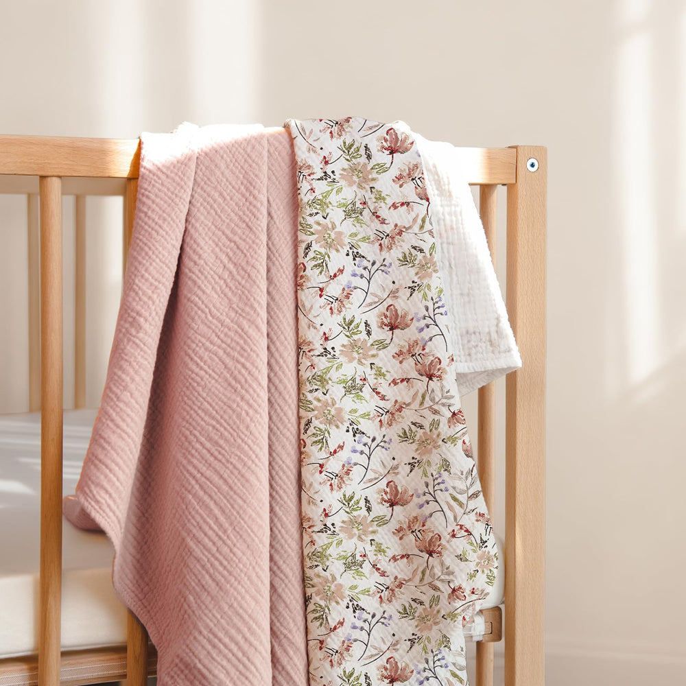Lulumoon Muslin Swaddle Blanket 40x40 inches demonstrates generous size for secure wrapping.