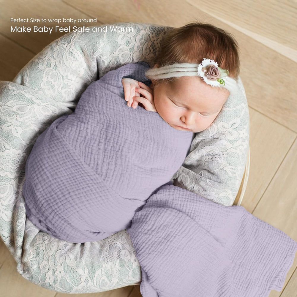 lulumoon muslin swaddle blanket baby swaddled sleeps calmly in breathable fabric